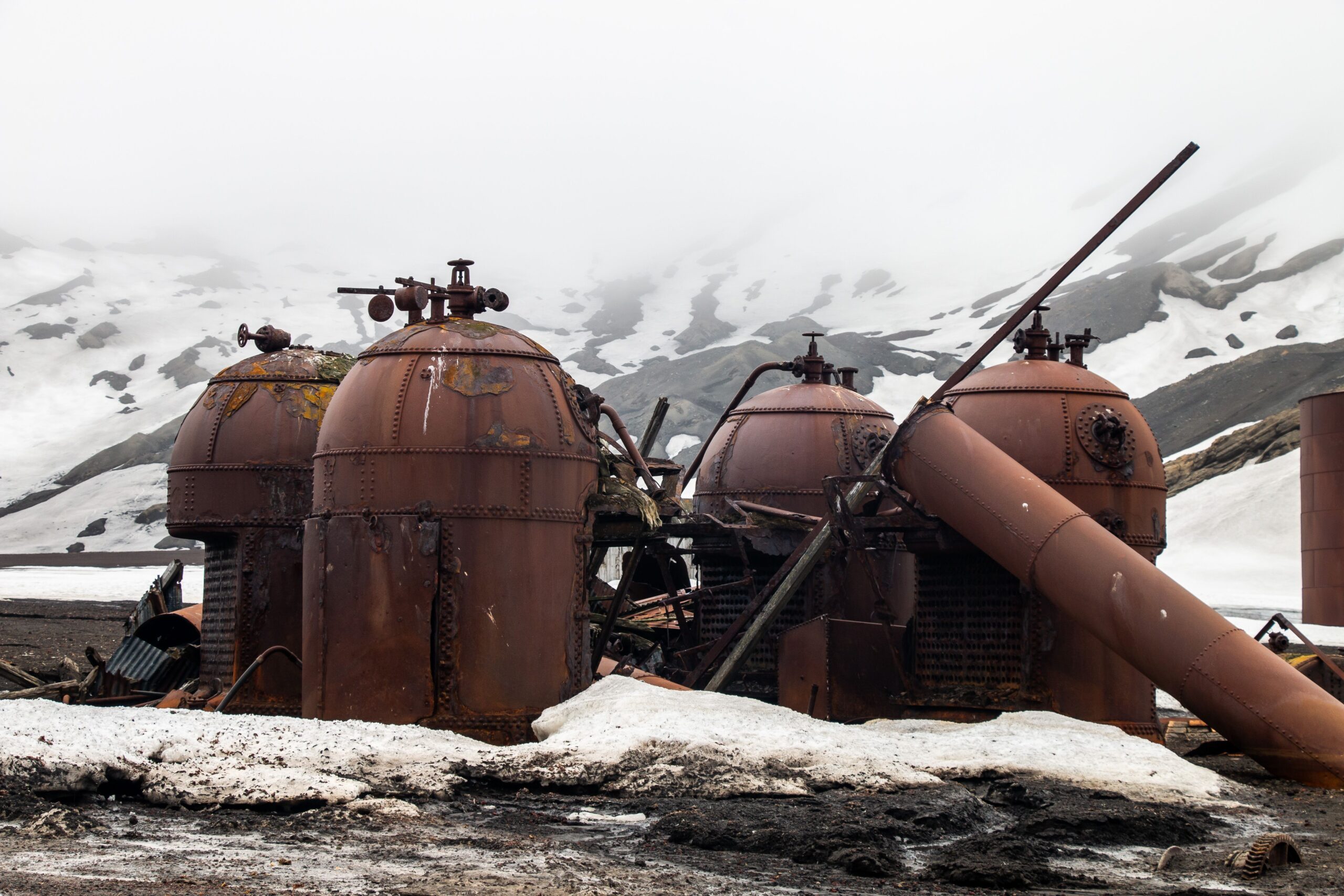 Large rusted oil drums from the arctic